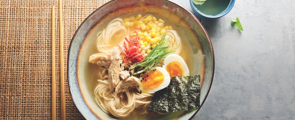 A bowl of Chicken Ramen with egg and nori sheet